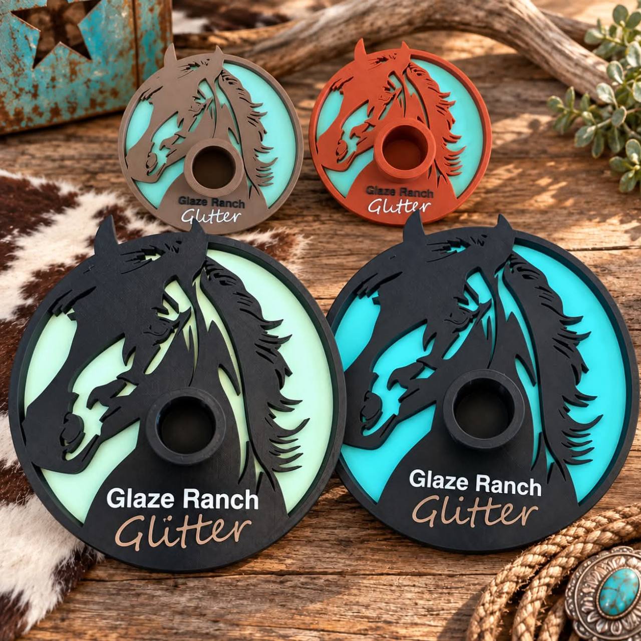 Four custom multicolor Glaze Ranch Glitter tumbler drying bases with horse branding